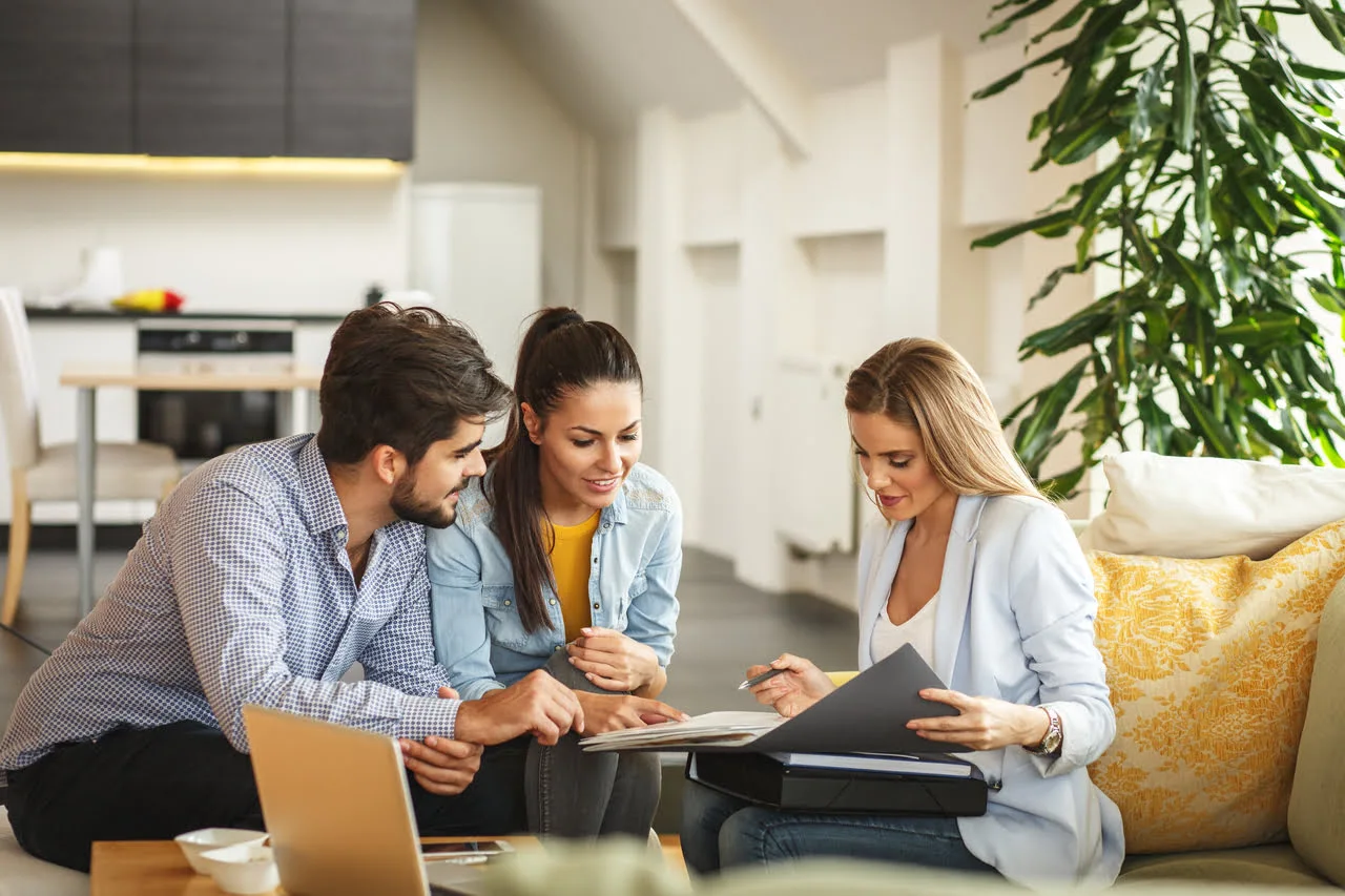 A group of people sitting around a table.