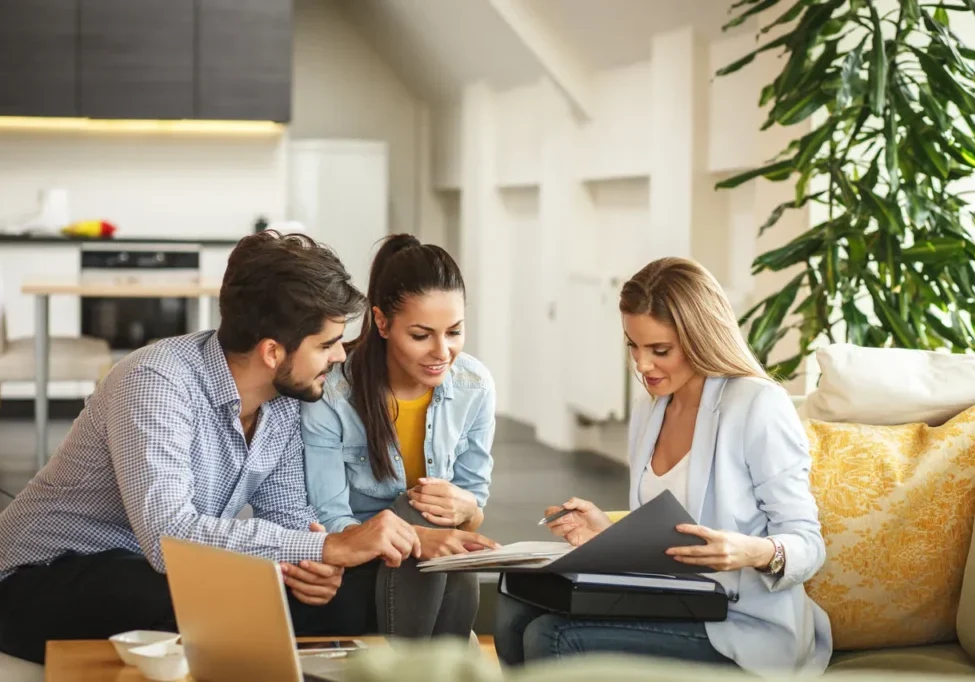 A group of people sitting around a table.